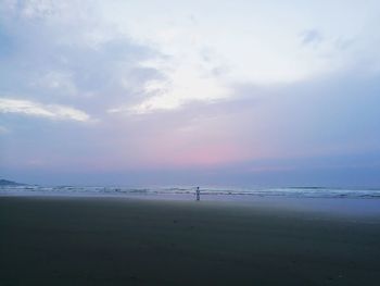 Scenic view of beach against sky during sunset