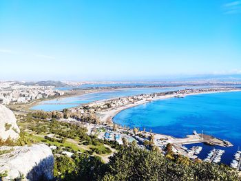 High angle view of swimming pool by sea against clear sky