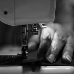 Cropped image of tailor hand sewing cloth