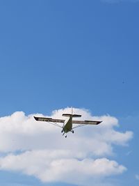 Low angle view of airplane flying in sky