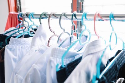 Close-up of clothes hanging on rack