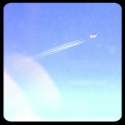 Low angle view of airplane flying in sky