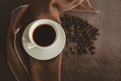 High angle view of coffee cup on table