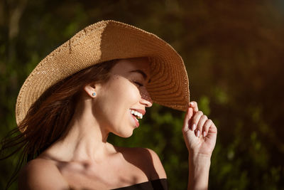 Young woman in sun hat close up