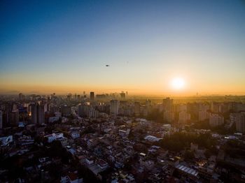 High angle view of city at sunset