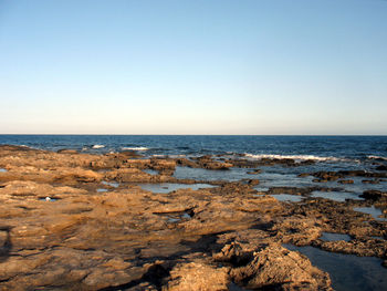 Scenic view of sea against clear sky