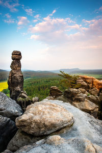 Stack of rocks on shore against sky