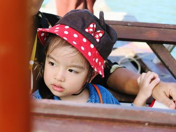 Portrait of cute girl looking away on a boat