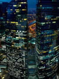 Aerial view of city lit up at night