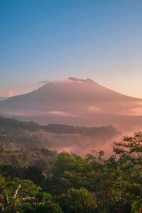 Scenic view of mountains against sky during sunset