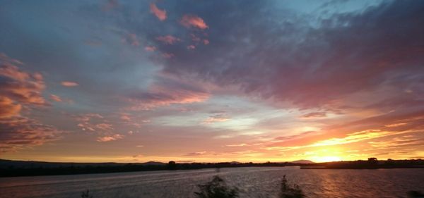 Scenic view of landscape against sky during sunset