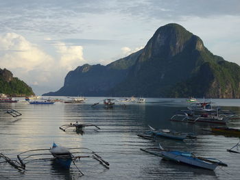 Boats moored in bay