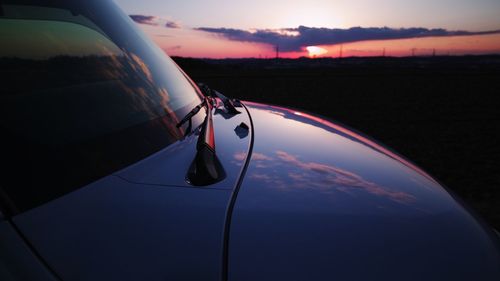 Cropped image of car during sunset