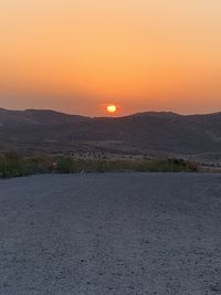 Scenic view of landscape against sky during sunset