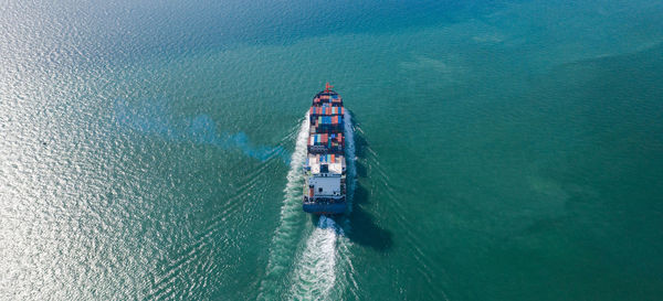 High angle view of ship sailing in sea