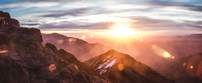 Scenic view of mountains against sky during sunset