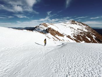 Scenic view of snowcapped mountain against sky