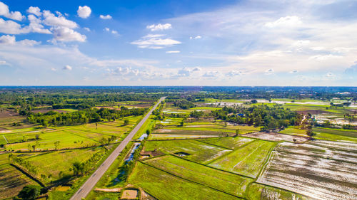 Scenic view of agricultural field against sky