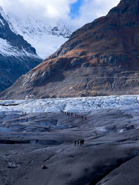 Scenic view of glscier and mountains against sky