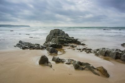 Scenic view of beach against sky