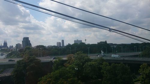 Cityscape against cloudy sky