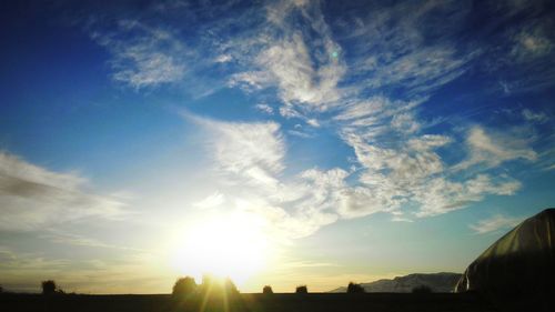 Sun shining through clouds