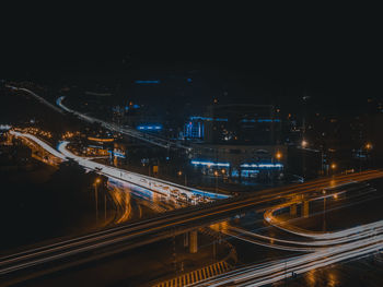 High angle view of light trails on road at night