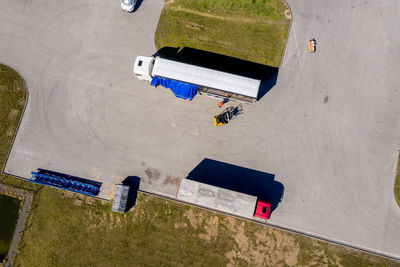 Aerial view of trucks and trailers. distribution logistics buildings