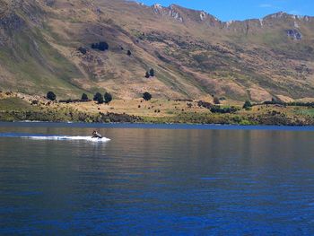 Scenic view of lake by mountain