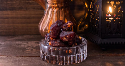 Close-up of wine glass in jar on table