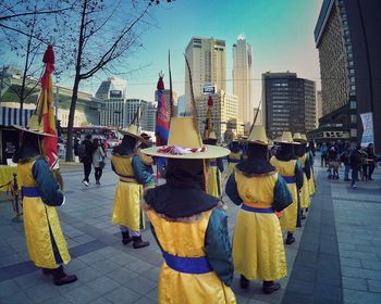 People walking on street in city