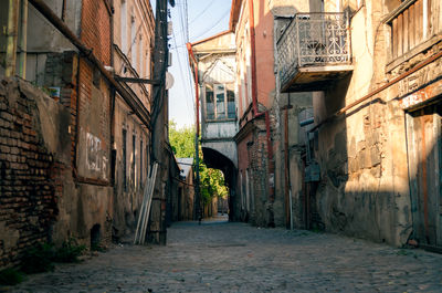 Narrow alley amidst buildings in city