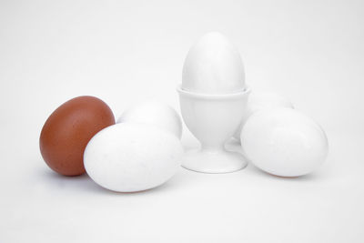 Close-up of eggs against white background