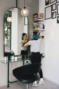 Female entrepreneur arranging things in salon