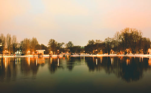 Scenic view of lake against sky during sunset