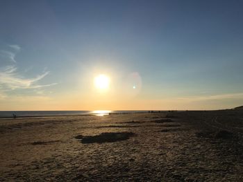 Scenic view of sea against sky at sunset