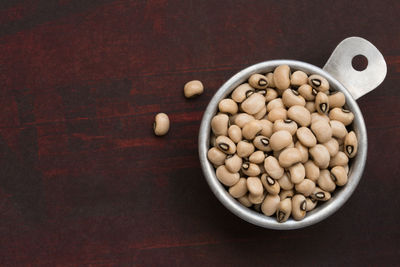 High angle view of green peas in bowl on table