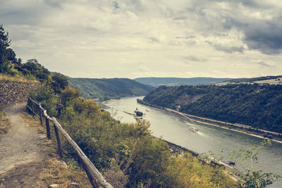 Scenic view of river and mountains against sky at kaub