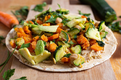 Close-up of chopped vegetables in plate on table