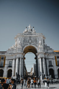 Group of people in front of historical building