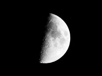 Low angle view of moon against clear sky at night