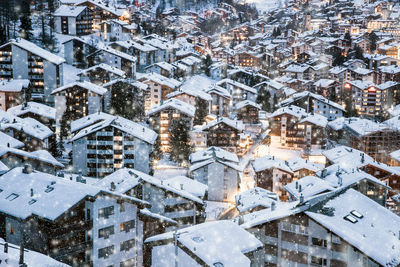 High angle view of buildings in town during winter