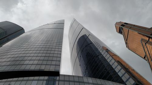 Low angle view of modern buildings against sky