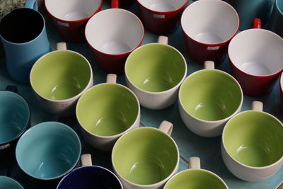 Full frame shot of colorful cups on table