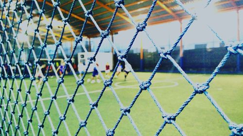 Soccer field seen through net