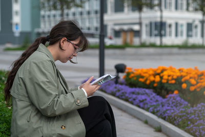 Young woman using mobile phone