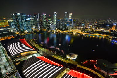 Aerial view of city lit up at night