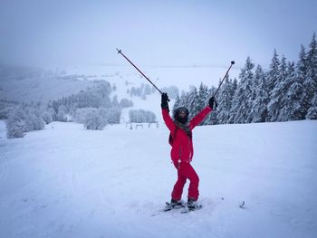 Full length of man on snowy field during winter