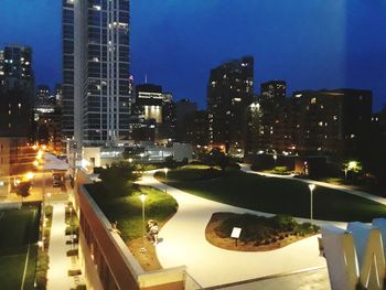 Illuminated buildings in city at night