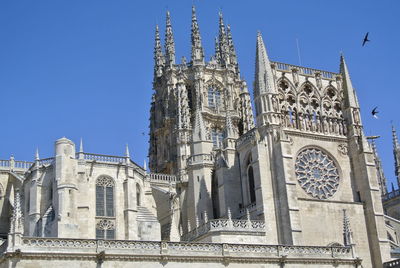 Low angle view of temple against blue sky